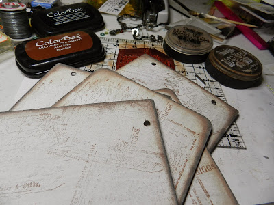 Prepped chipboard pages painted and distress inked